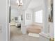 Elegant primary bathroom featuring a soaking tub, columns, and adjacent bedroom view at 5891 Nw 26Th St, Ocala, FL 34482
