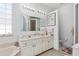 Spacious bathroom with a double vanity, soaking tub, toilet, and stylish decor at 5891 Nw 26Th St, Ocala, FL 34482
