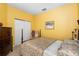 Bright bedroom with a traditional bed, neutral carpet, and ample closet space at 5891 Nw 26Th St, Ocala, FL 34482