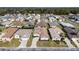 Overhead aerial showcasing a residential community featuring diverse home styles, landscaping, and neighborhood streets at 5891 Nw 26Th St, Ocala, FL 34482