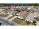 Aerial photo depicting a residential community with diverse homes, green lawns, and well-maintained streets at 5891 Nw 26Th St, Ocala, FL 34482
