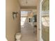 Sunlit entryway that leads to a screened-in lanai, complemented by neutral walls and stylish decor at 5891 Nw 26Th St, Ocala, FL 34482