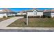 Attractive single-story home with a curved driveway and manicured bushes in a residential neighborhood at 5891 Nw 26Th St, Ocala, FL 34482