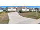 Lovely one-story home featuring a curved driveway, well-maintained landscaping, and a two-car garage at 5891 Nw 26Th St, Ocala, FL 34482