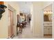 Inviting hallway with tiled floors leading to a dining area and a bathroom at 5891 Nw 26Th St, Ocala, FL 34482