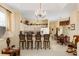 Open kitchen with a breakfast bar and white cabinetry, flowing into the dining and living areas at 5891 Nw 26Th St, Ocala, FL 34482