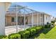 Inviting outdoor lanai and pool area surrounded by lush landscaping for privacy and relaxation at 5891 Nw 26Th St, Ocala, FL 34482