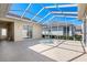 Outdoor lanai with caged pool and patio furniture, ideal for relaxing or entertaining guests at 5891 Nw 26Th St, Ocala, FL 34482