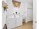 Functional laundry room featuring a washing machine, dryer, utility sink, and closet for storage at 5891 Nw 26Th St, Ocala, FL 34482