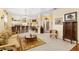 Spacious living area with a bar counter, neutral colors, and a seamless connection to the dining space at 5891 Nw 26Th St, Ocala, FL 34482