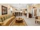 Expansive living room with a kitchen bar, neutral walls, and a connection to the dining room at 5891 Nw 26Th St, Ocala, FL 34482