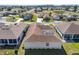 Overhead view of a house highlighting the roof, landscaping, and surrounding community amenities at 5891 Nw 26Th St, Ocala, FL 34482