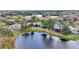 A picturesque aerial view of lakeside homes surrounded by mature trees and scenic water views at 615 Midway Dr # B, Ocala, FL 34472