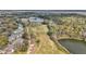 An aerial shot of a sprawling golf course and lakefront homes surrounded by nature at 615 Midway Dr # B, Ocala, FL 34472