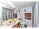 A bathroom featuring a large mirror, a pink countertop sink, and a shower with striped curtains at 615 Midway Dr # B, Ocala, FL 34472