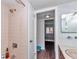 A view from the shower area into a connecting room, showcasing the layout and access at 615 Midway Dr # B, Ocala, FL 34472