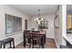 Eat-in dining room with table, four chairs, and large window at 615 Midway Dr # B, Ocala, FL 34472