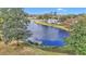 A scenic lake view highlighting lush greenery and beautiful waterfront homes at 615 Midway Dr # B, Ocala, FL 34472