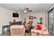 Inviting living room featuring neutral walls, ceiling fan, and television at 615 Midway Dr # B, Ocala, FL 34472