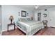 Bright bedroom featuring a ceiling fan, comfortable bed, and stylish decor creating a tranquil retreat at 615 Midway Dr # B, Ocala, FL 34472