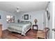 Comfortable bedroom featuring a large bed, ceiling fan, and ample natural light from the window creating a relaxing space at 615 Midway Dr # B, Ocala, FL 34472