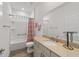 Well-lit bathroom with a shower-tub combo and stylish vanity at 7908 Sw 89Th Cir, Ocala, FL 34481