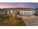 Charming single-story home featuring a two-car garage, a brick-paved driveway, and well-maintained landscaping at 7908 Sw 89Th Cir, Ocala, FL 34481