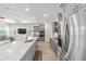 Bright kitchen with gray cabinets, stainless appliances, and large island at 7908 Sw 89Th Cir, Ocala, FL 34481