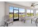 Screened in lanai with comfortable patio chairs and backyard views at 7908 Sw 89Th Cir, Ocala, FL 34481