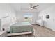 Primary bedroom with tray ceiling, white trim, and a view to the exterior at 7908 Sw 89Th Cir, Ocala, FL 34481
