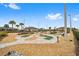 Enjoy Gathering fun at the putting course complete with landscaping, stone walkways, and manicured greens at 7908 Sw 89Th Cir, Ocala, FL 34481
