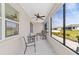 Relaxing covered patio with ceiling fan and ample seating, perfect for enjoying the outdoors at 7908 Sw 89Th Cir, Ocala, FL 34481