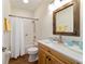 Cozy bathroom with a wood vanity, marble countertops, and shower tub combo at 8342 Sw 82Nd Loop, Ocala, FL 34481