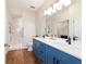 Bathroom features double sink, walk in shower, and modern fixtures at 8342 Sw 82Nd Loop, Ocala, FL 34481