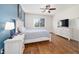 Bedroom featuring natural lighting, wood look floors, and white washed furniture at 8342 Sw 82Nd Loop, Ocala, FL 34481