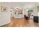 Dining area open to kitchen with hardwood flooring and modern lighting at 8342 Sw 82Nd Loop, Ocala, FL 34481