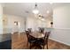 Dining room with hardwood floors adjacent to kitchen with bright, open floor plan at 8342 Sw 82Nd Loop, Ocala, FL 34481