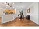 Inviting dining area adjacent to kitchen, featuring hardwood floors and natural light at 8342 Sw 82Nd Loop, Ocala, FL 34481