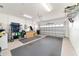 Spacious garage with epoxy floors and ample storage for vehicles and tools at 8342 Sw 82Nd Loop, Ocala, FL 34481