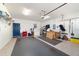 Spacious garage with bright lighting, storage shelves, and epoxy flooring at 8342 Sw 82Nd Loop, Ocala, FL 34481