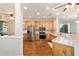 Well-lit kitchen features stainless steel appliances, granite countertops, and light wood cabinets at 8342 Sw 82Nd Loop, Ocala, FL 34481