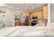 Modern kitchen with custom cabinets, stainless steel appliances, and quartz countertops at 8342 Sw 82Nd Loop, Ocala, FL 34481