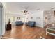 Spacious living room with hardwood floors, ceiling fan and ample natural light at 8342 Sw 82Nd Loop, Ocala, FL 34481
