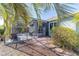 Relaxing screened-in patio area with comfortable seating for outdoor enjoyment, plus lovely landscaping at 8342 Sw 82Nd Loop, Ocala, FL 34481