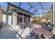 Relaxing screened-in patio with comfortable seating and outdoor space at 8342 Sw 82Nd Loop, Ocala, FL 34481