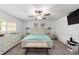 Comfortable bedroom with two dressers, soft bedding, and natural light, ideal for restful nights at 8350 Sw 93Rd Ln # C, Ocala, FL 34481