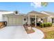 Attractive single-story home showcasing a well-kept lawn and an inviting, covered front porch at 8350 Sw 93Rd Ln # C, Ocala, FL 34481