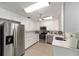 Stylish kitchen boasting stainless steel appliances, white cabinets, and modern countertops for a sleek design at 8350 Sw 93Rd Ln # C, Ocala, FL 34481