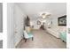 Bright living room with neutral carpet, ceiling fans, and comfortable white sofa at 8350 Sw 93Rd Ln # C, Ocala, FL 34481