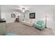 Spacious living room featuring neutral carpeting, white walls, and a comfortable seating area at 8350 Sw 93Rd Ln # C, Ocala, FL 34481